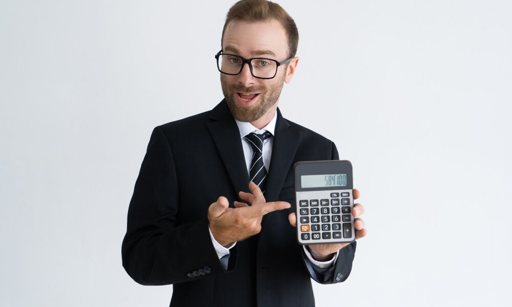 enterprising-bearded-businessman-pointing-calculator (1)